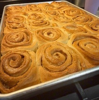 A full pan of freshly baked cinnamon rolls
