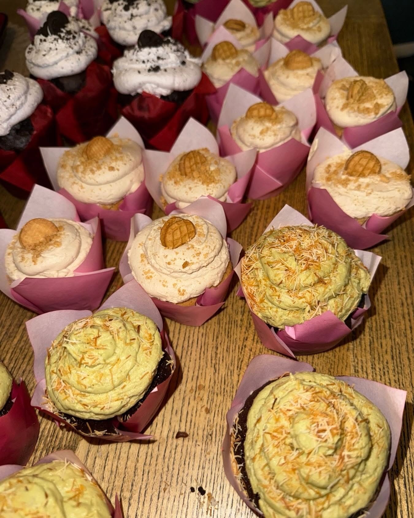 An assortment of decorated cupcakes ready for an order
