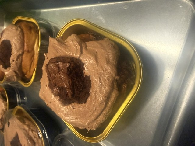 Chocolate frosting piped into heart-shaped molds